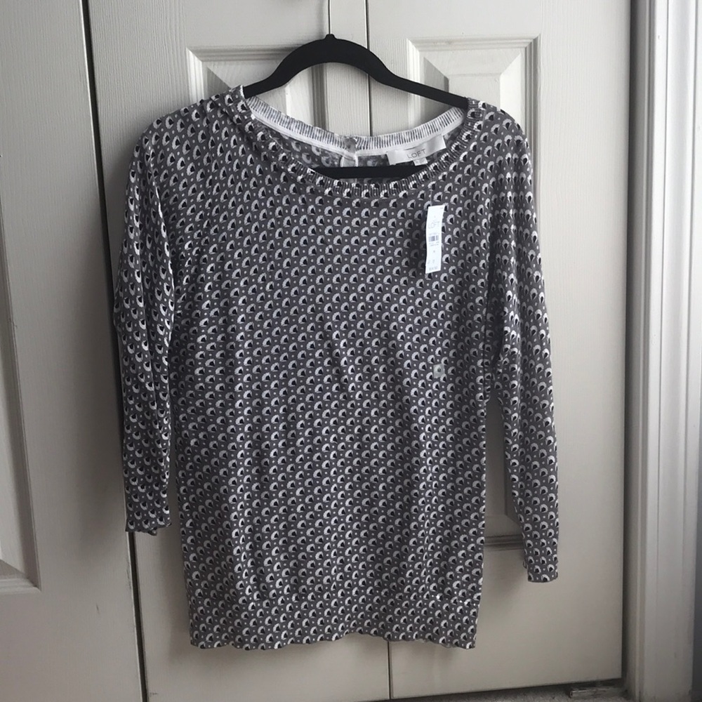 Grey sweater with black and white design